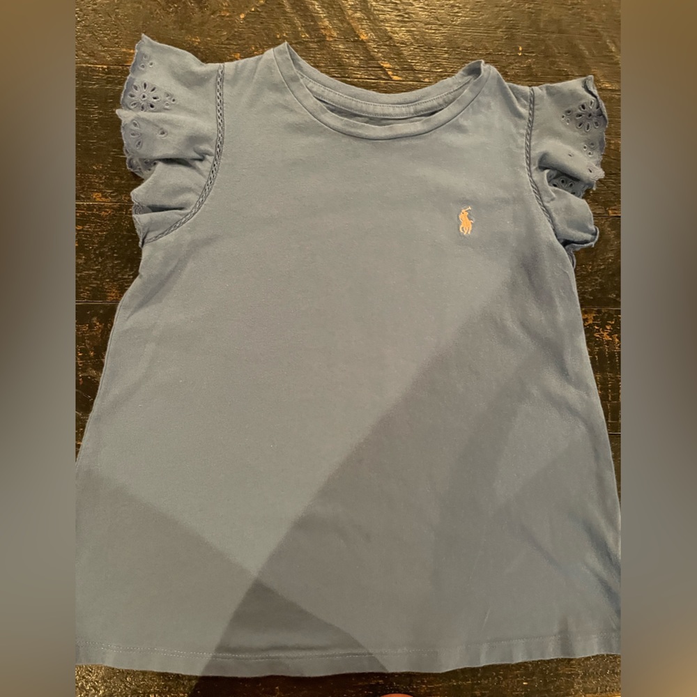 Gently worn Polo girls size 6 blue flared t-shirt with eyelet capped sleeves.